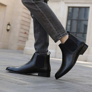 Black leather Chelsea boots.