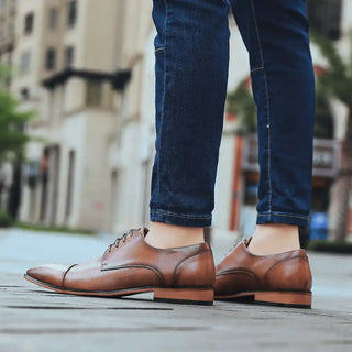 Brown leather dress shoes.