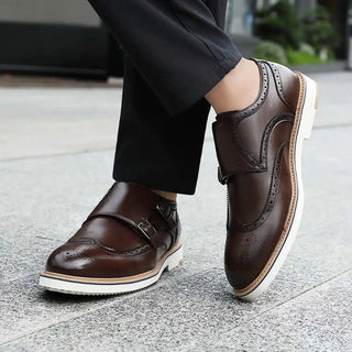 Brown leather monk strap shoes.