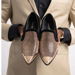 Pair of gold-toned, studded loafers.