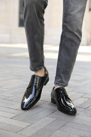 Shiny black dress shoes.