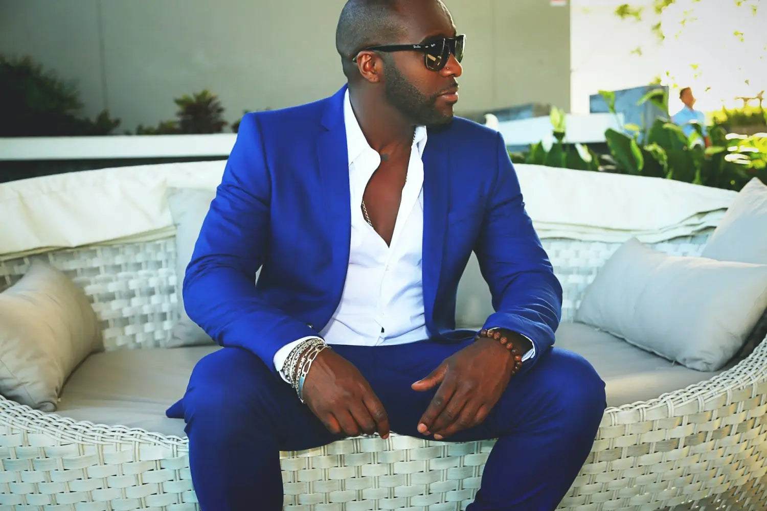 A stylish man wearing a royal blue suit