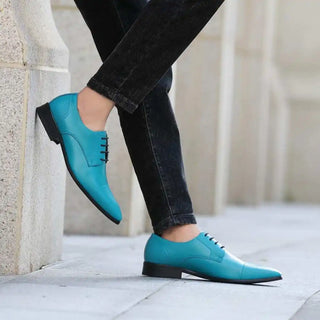 Turquoise leather dress shoes.